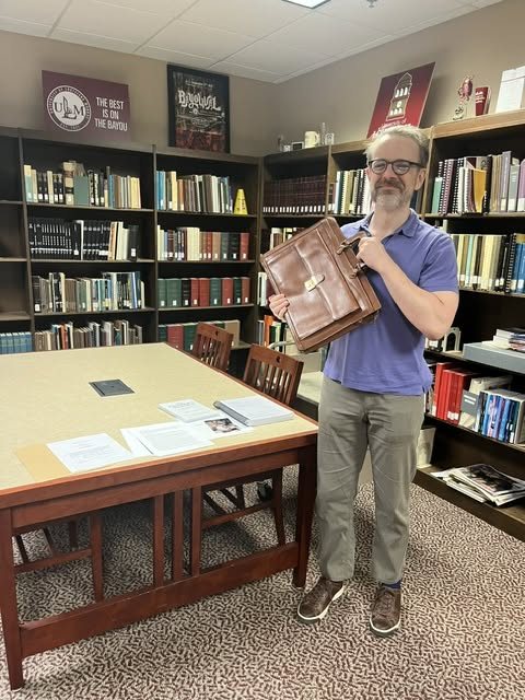 Dennard McInnis delivering John Lawson McInnis III archive materials to ULM Special Collections in 2026